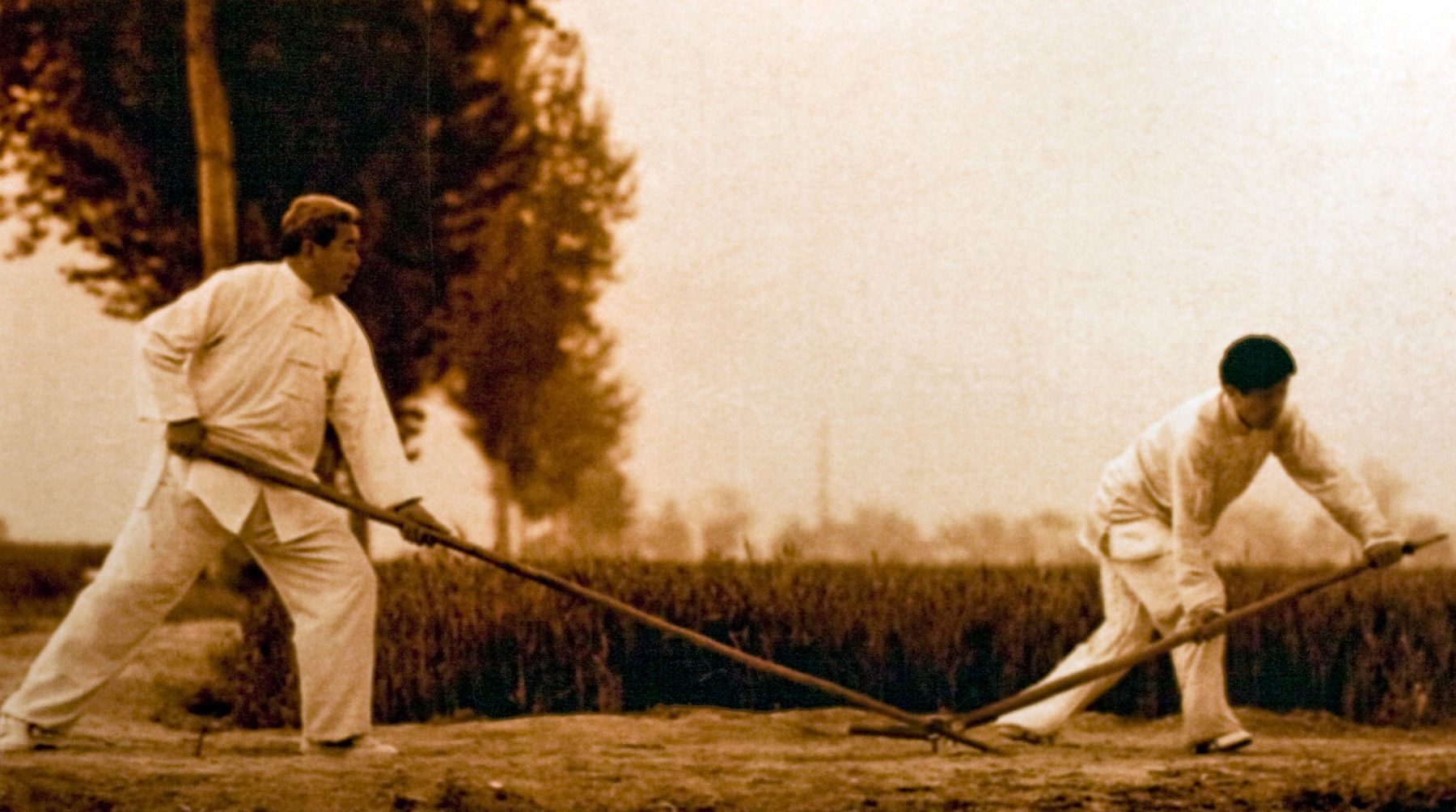 Chen Chunlei and Chen Zhenglei practicing traditional weapon sparring in Chenjiagou