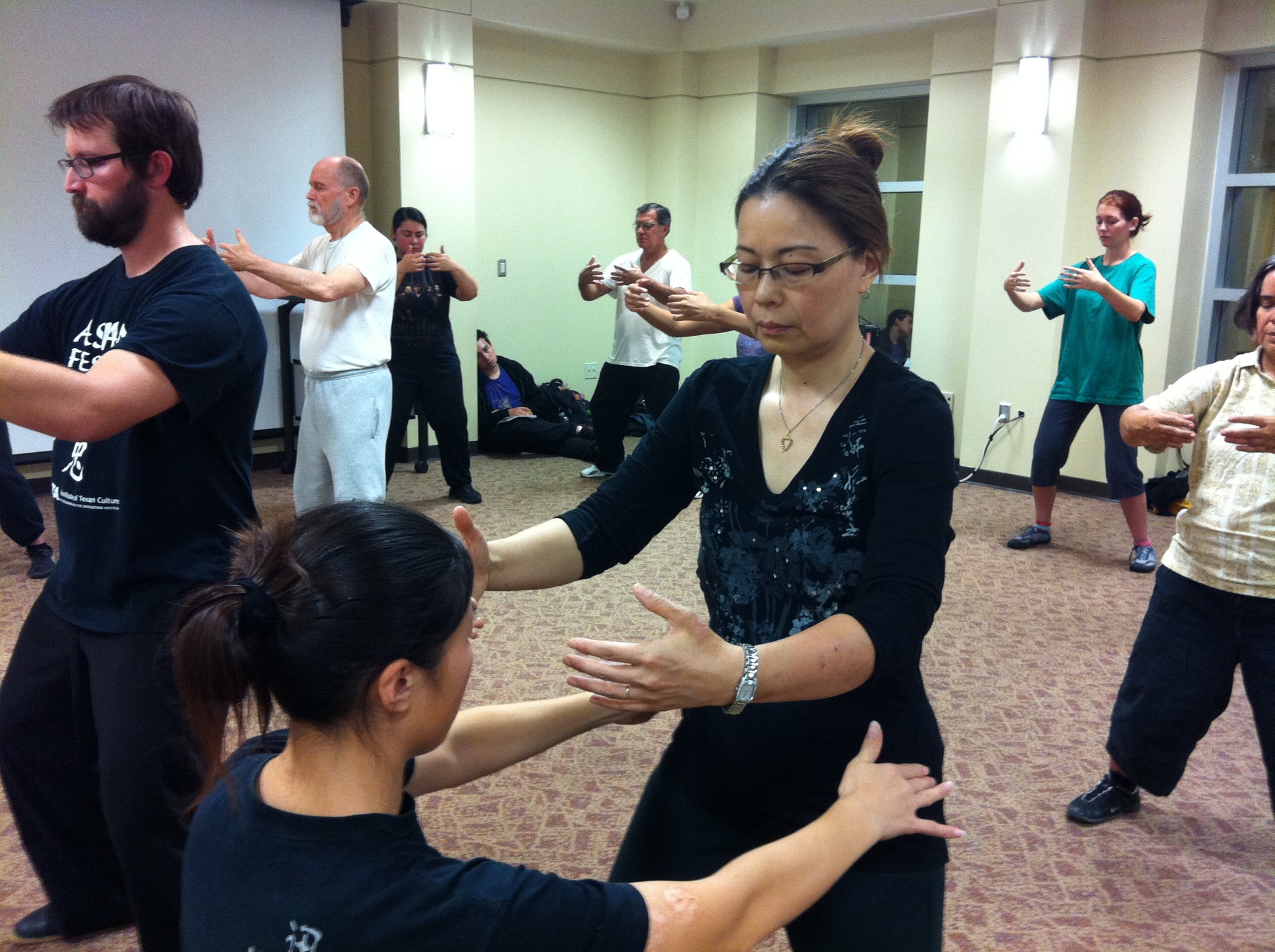Hands-on partner instruction during a San Antonio Chen Taijiquan workshop